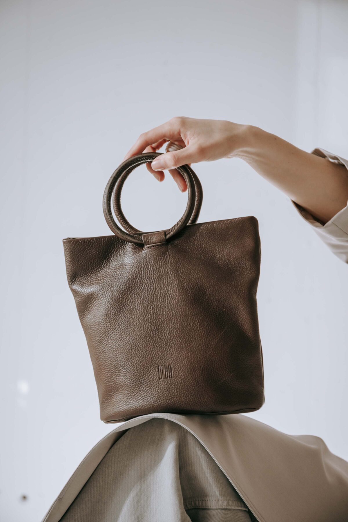 BIBA design — leather bag with metal handles